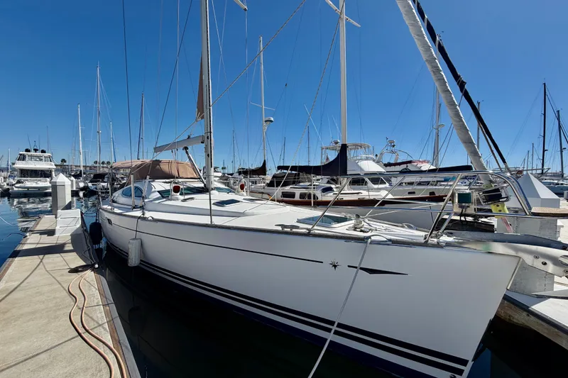 Slide: The Image of 2008 Jeanneau Sun Odyssey 49 DS sailboat docked at marina under clear blue sky. - 3