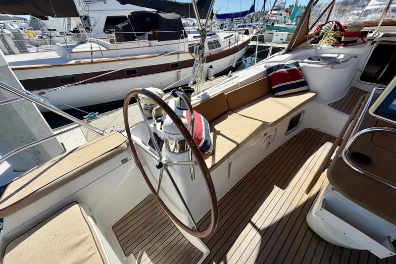 Slide: The Image of Cockpit of 2008 Jeanneau Sun Odyssey 49 DS sailboat with wooden deck and seating. - 20