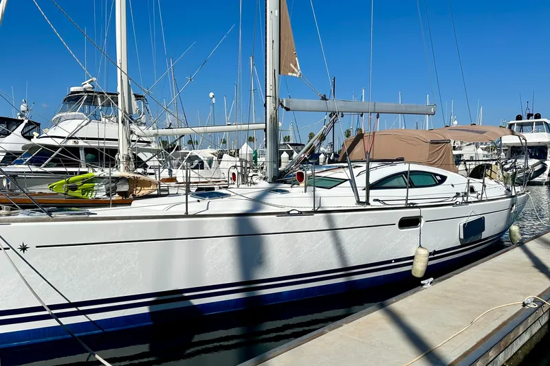 Slide: The Image of 2008 Jeanneau Sun Odyssey 49 DS sailboat docked at marina under clear blue sky. - 10
