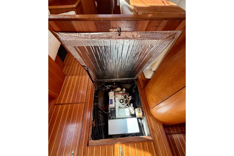 Slide: The Image of Engine compartment of 2008 Jeanneau Sun Odyssey 49 DS sailboat, showcasing interior mechanics. - 64
