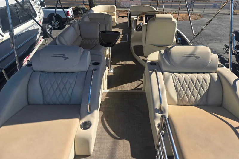Slide: The Image of 2014 Bennington 2875 QCW I/O boat interior with luxurious seating and elegant design. - 2