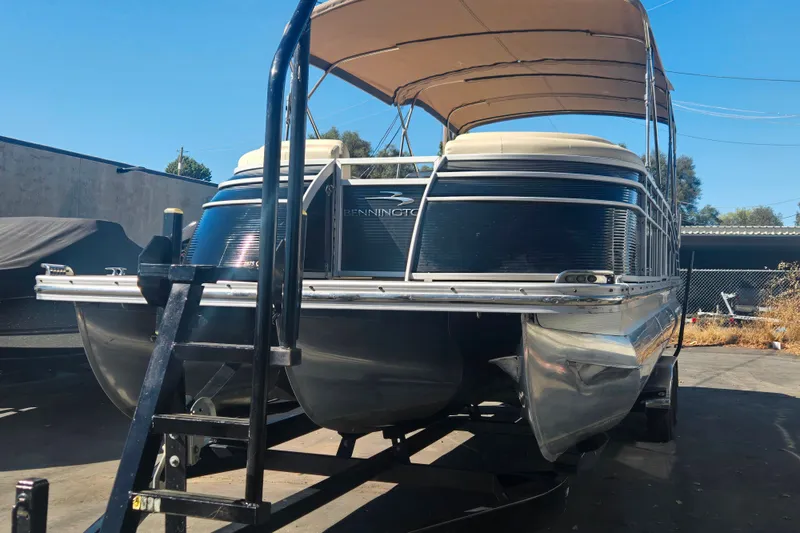 Slide: The Image of 2014 Bennington 2875 QCW I/O pontoon boat with canopy on trailer. - 8