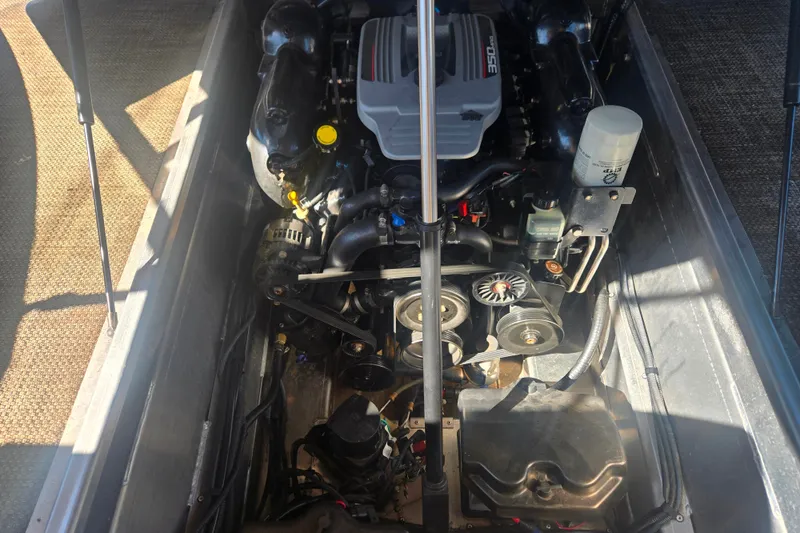 Slide: The Image of Engine compartment of a 2014 Bennington 2875 QCW I/O boat, showcasing mechanical components. - 9