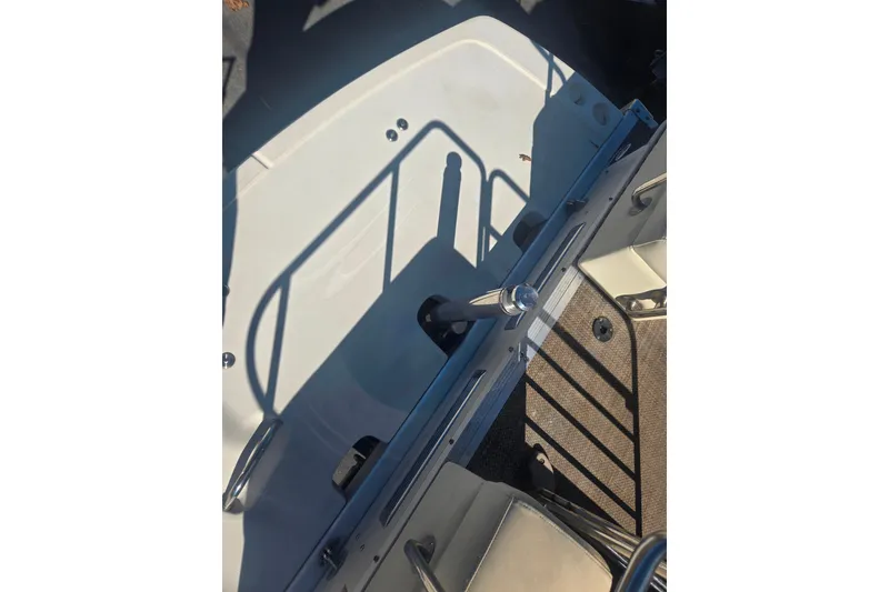 Slide: The Image of 2014 Bennington 2875 QCW I/O boat interior with seating and railing details. - 12