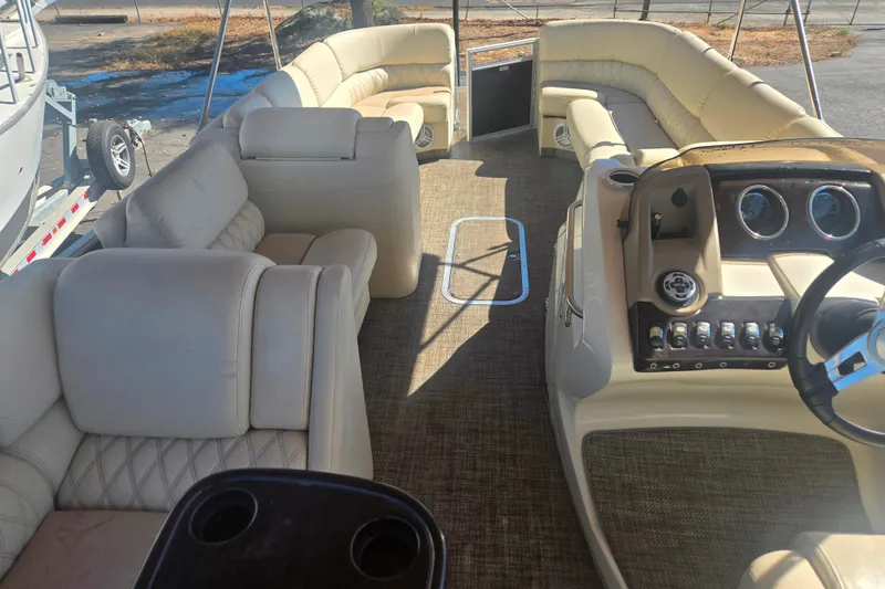 Slide: The Image of Luxurious interior of a 2014 Bennington 2875 QCW I/O pontoon boat with plush seating. - 11