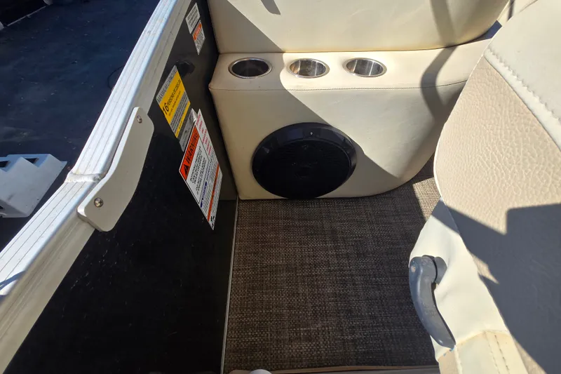 Slide: The Image of Interior of a 2014 Bennington 2875 QCW I/O boat with cup holders and speaker. - 5