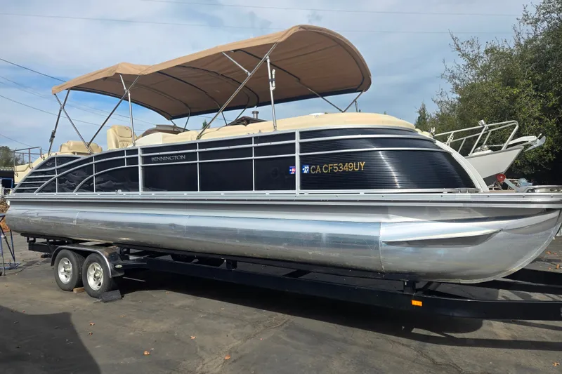 The Image of 2014 Bennington 2875 QCW I/O pontoon boat on trailer with canopy. - 0