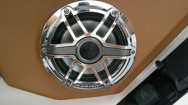Slide: The Image of Close-up of a JL Audio speaker with chrome grille in a boat. - 16