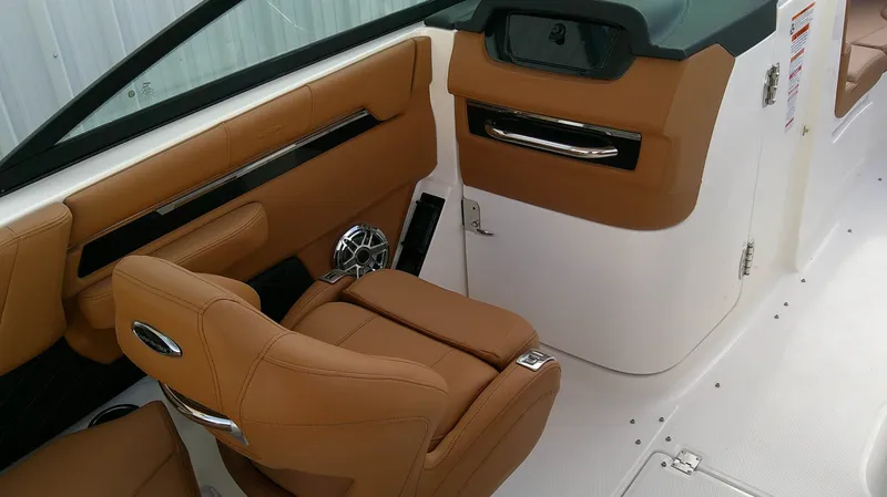 Slide: The Image of Interior of a 2027 Chaparral SSX 6 with brown leather seats and modern dashboard. - 17