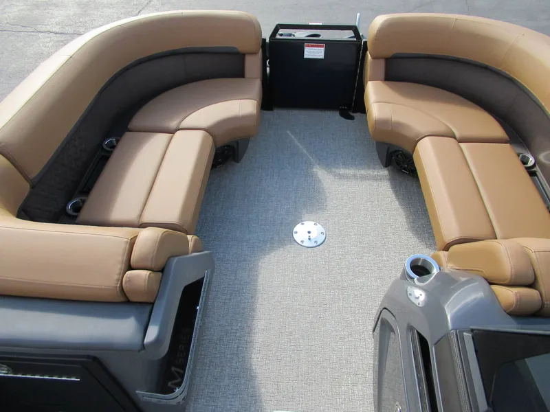 Slide: The Image of Interior view of a Bennington 22 MFB pontoon boat with beige leather seating and gray carpet flooring. - 3