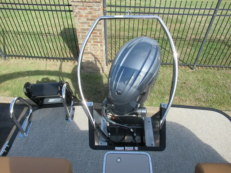Slide: The Image of An outboard motor on a Bennington 22 MFB boat, surrounded by a metal frame. - 5