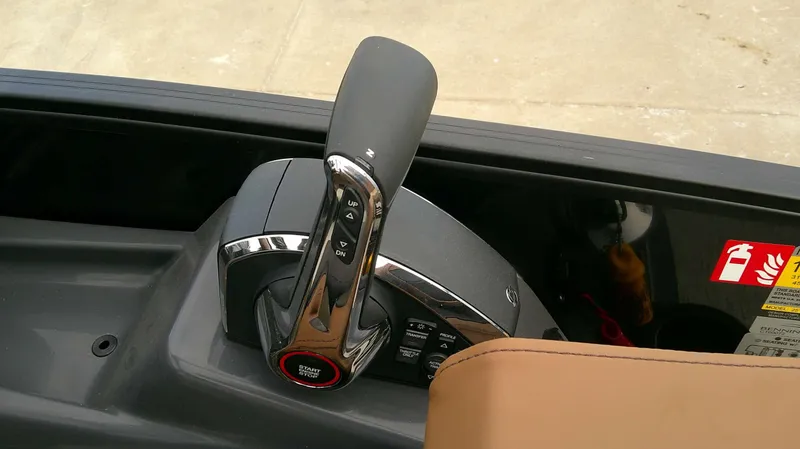 Slide: The Image of Close-up of the throttle lever on a Bennington M 26 boat. - 19