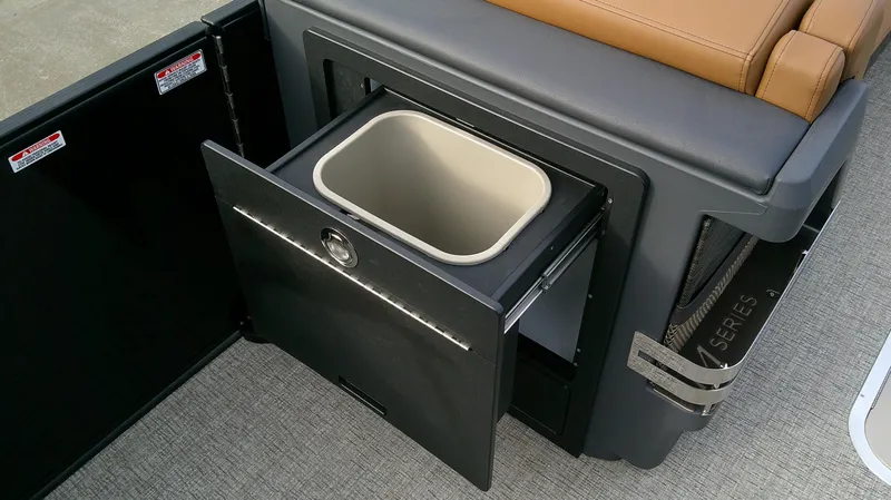 Slide: The Image of A sleek trash bin in a modern boat cabinet. - 13