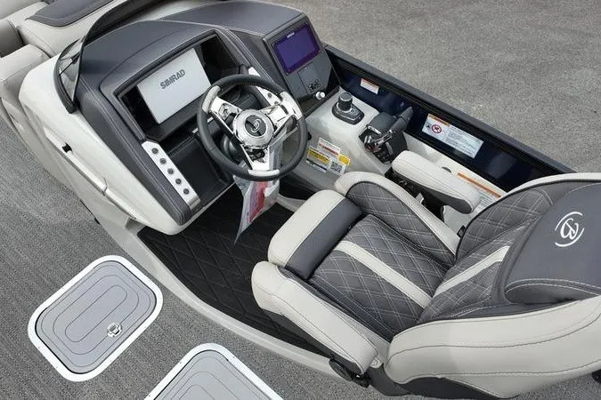 Slide: The Image of 2025 Barletta LUSSO 25UCAT boat interior with modern steering and luxurious seating. - 10