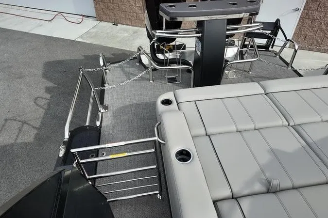 Slide: The Image of 2025 Barletta LUSSO 25UCAT pontoon boat with sleek seating and modern design. - 22