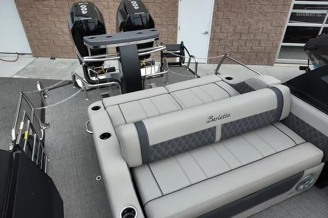 Slide: The Image of 2025 Barletta LUSSO 25UCAT pontoon boat with dual engines and luxurious seating. - 17