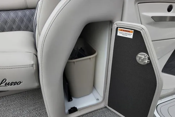 Slide: The Image of Interior storage compartment of 2025 Barletta LUSSO 25UCAT boat with trash bin. - 5