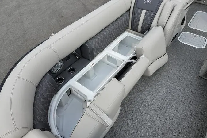 Slide: The Image of 2025 Barletta LUSSO 25UCAT boat interior with open storage compartments and luxurious seating. - 2