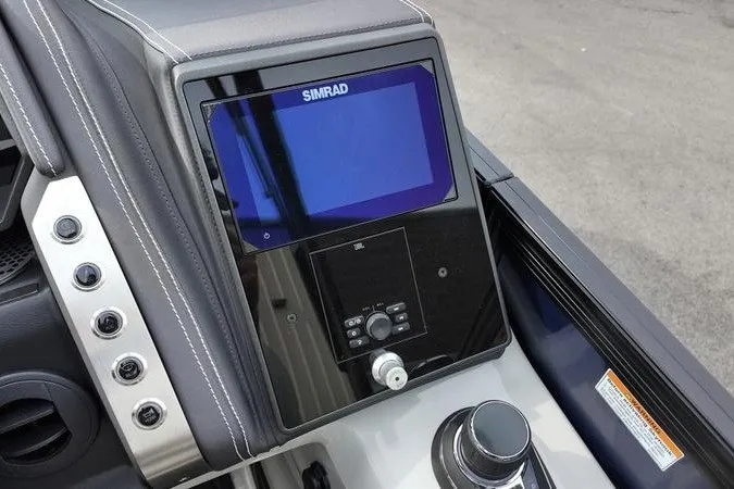 Slide: The Image of 2025 Barletta LUSSO 25UCAT dashboard with Simrad display and controls. - 12
