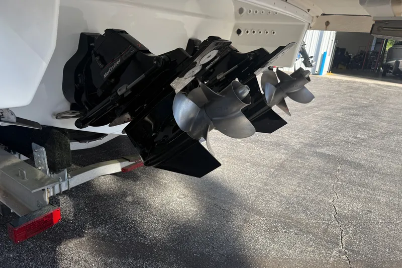 Slide: The Image of 2020 Formula 350 Crossover Bowrider with dual MerCruiser propellers on a trailer. - 11