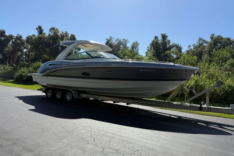 Slide: The Image of 2020 Formula 350 Crossover Bowrider on trailer, parked on a sunny day. - 7