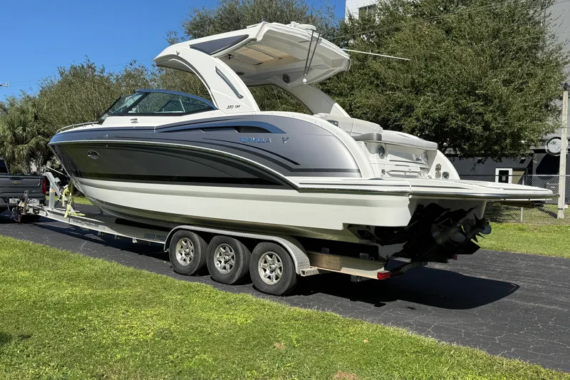 Slide: The Image of 2020 Formula 350 Crossover Bowrider on trailer, parked outdoors on sunny day. - 3