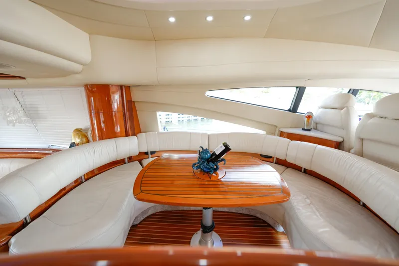 Slide: The Image of Luxurious interior of 2007 Azimut 68E yacht with elegant seating and wooden table. - 21