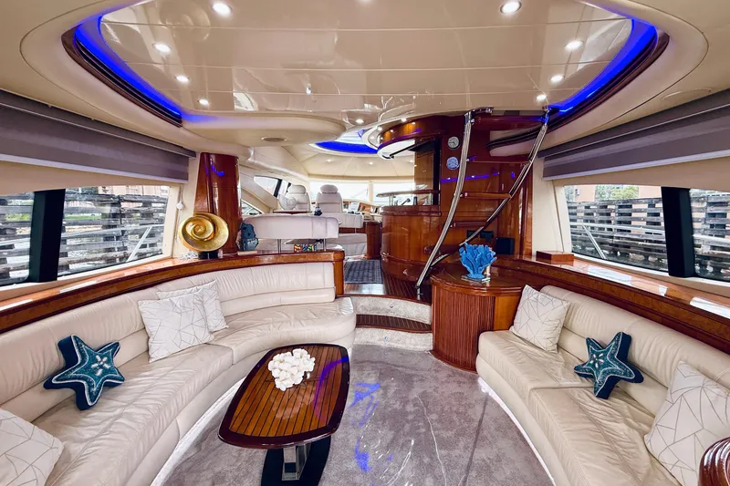 Slide: The Image of Luxurious interior of a 2007 Azimut 68E yacht with elegant seating and modern design. - 9