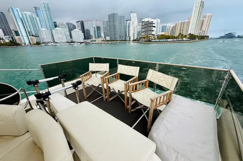 Slide: The Image of Luxurious 2007 Azimut 68E yacht deck with city skyline view. - 82
