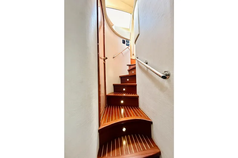 Slide: The Image of Elegant wooden staircase with lighting on a 2007 Azimut 68E yacht interior. - 35