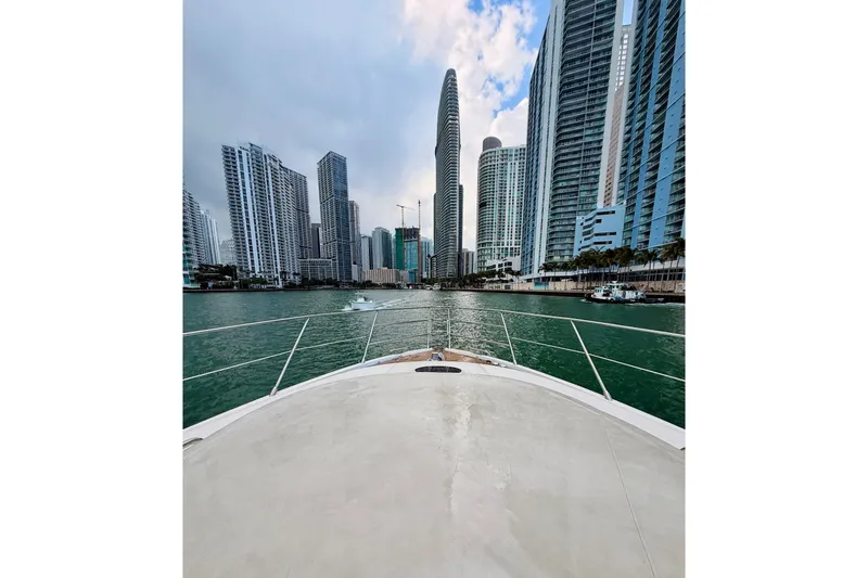 Slide: The Image of Bow view from 2007 Azimut 68E yacht, approaching city skyline with tall buildings. - 68
