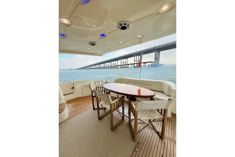 Slide: The Image of Luxurious 2007 Azimut 68E yacht deck with elegant seating and ocean view. - 62