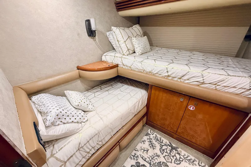 Slide: The Image of Luxurious 2007 Azimut 68E yacht cabin with twin beds and elegant decor. - 40
