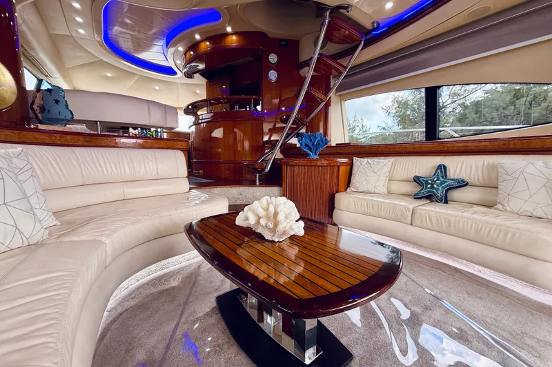 Slide: The Image of Luxurious interior of 2007 Azimut 68E yacht with elegant seating and modern decor. - 13
