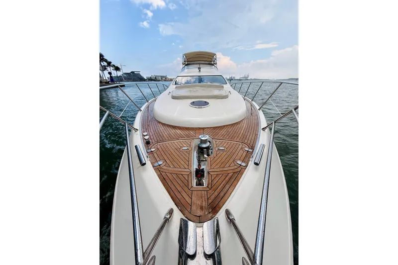 Slide: The Image of 2007 Azimut 68E yacht with sleek deck design on open water. - 70