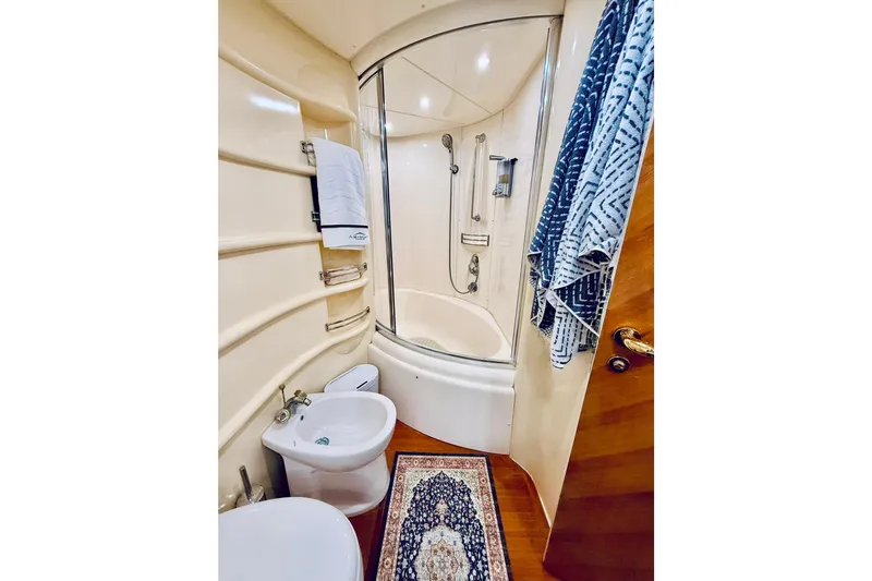 Slide: The Image of Luxurious bathroom in 2007 Azimut 68E yacht with modern fixtures and elegant design. - 57