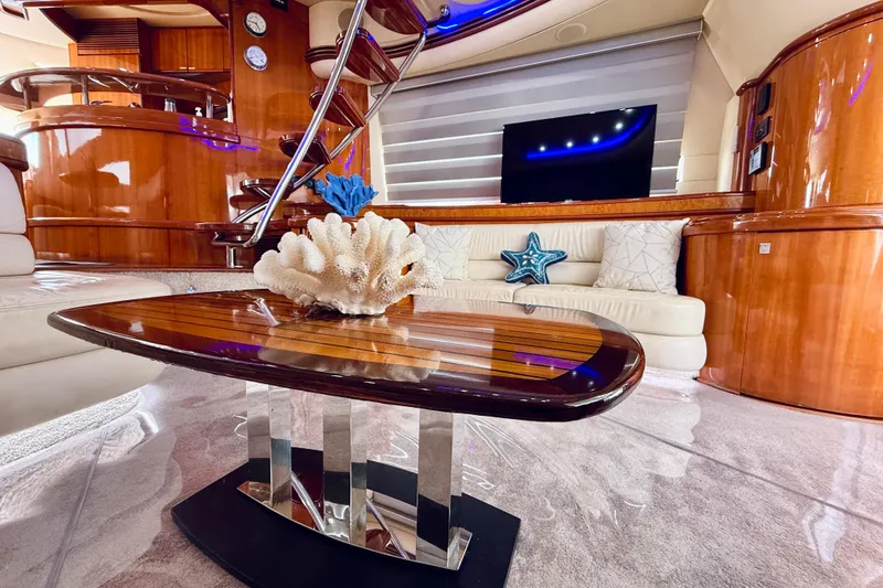 Slide: The Image of Luxurious interior of 2007 Azimut 68E yacht with elegant wood finishes and modern decor. - 14