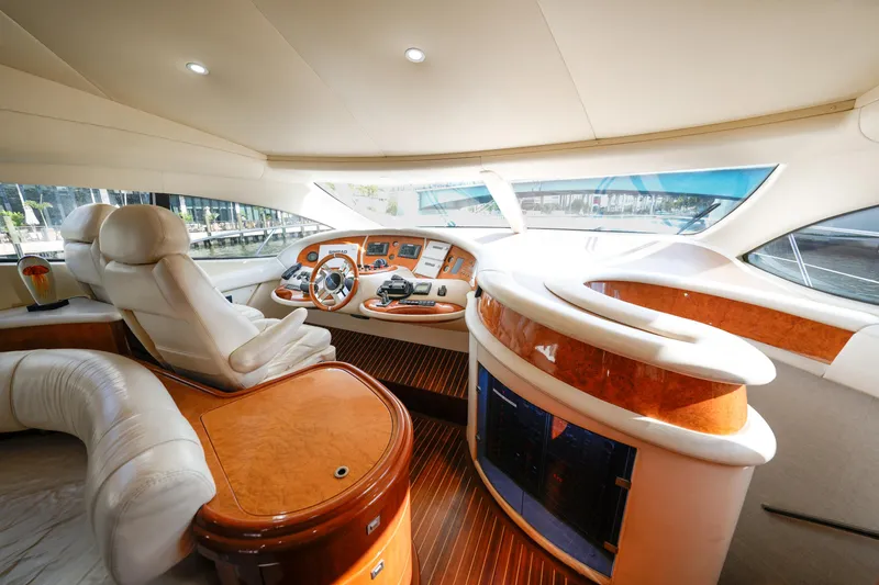 Slide: The Image of Luxurious interior of a 2007 Azimut 68E yacht with elegant wood and leather finishes. - 28