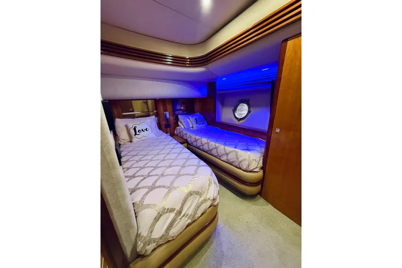 Slide: The Image of Luxurious 2007 Azimut 68E yacht cabin with twin beds and elegant decor. - 41