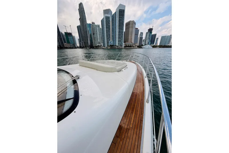 Slide: The Image of 2007 Azimut 68E yacht with city skyline in the background. - 66
