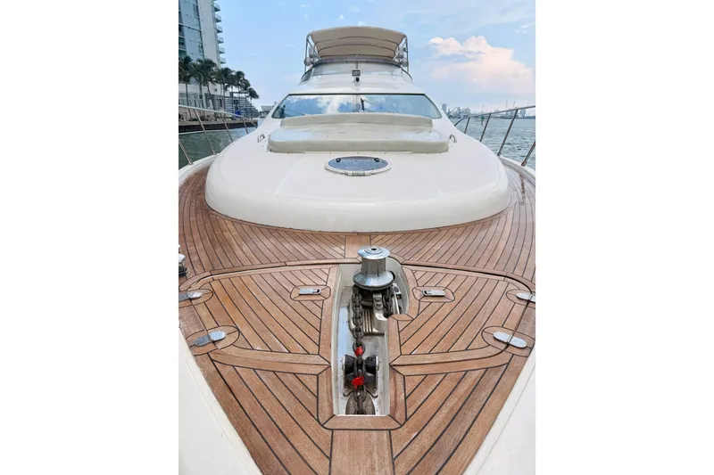Slide: The Image of 2007 Azimut 68E yacht with sleek wooden deck and modern design. - 71