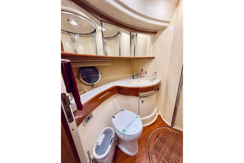 Slide: The Image of Luxurious bathroom in 2007 Azimut 68E yacht with elegant fixtures and wood accents. - 42