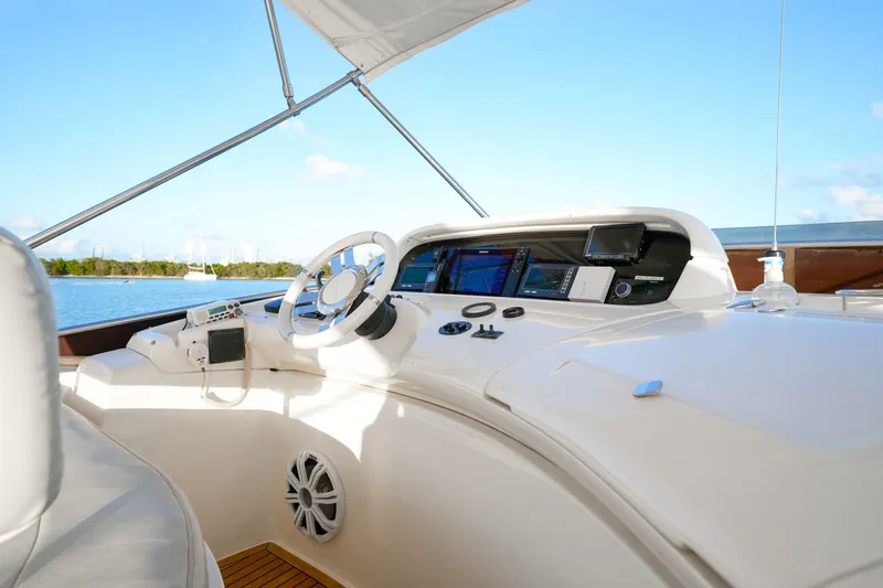Slide: The Image of Cockpit of 2007 Azimut 68E yacht with navigation equipment and steering wheel. - 76