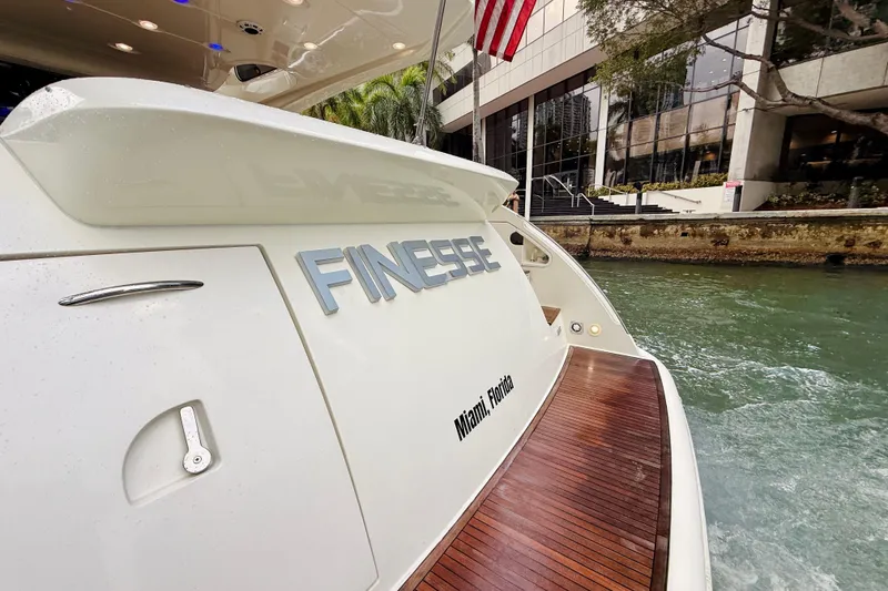 Slide: The Image of Azimut 68E 2007 yacht "Finesse" docked in Miami, Florida, with wooden deck. - 86