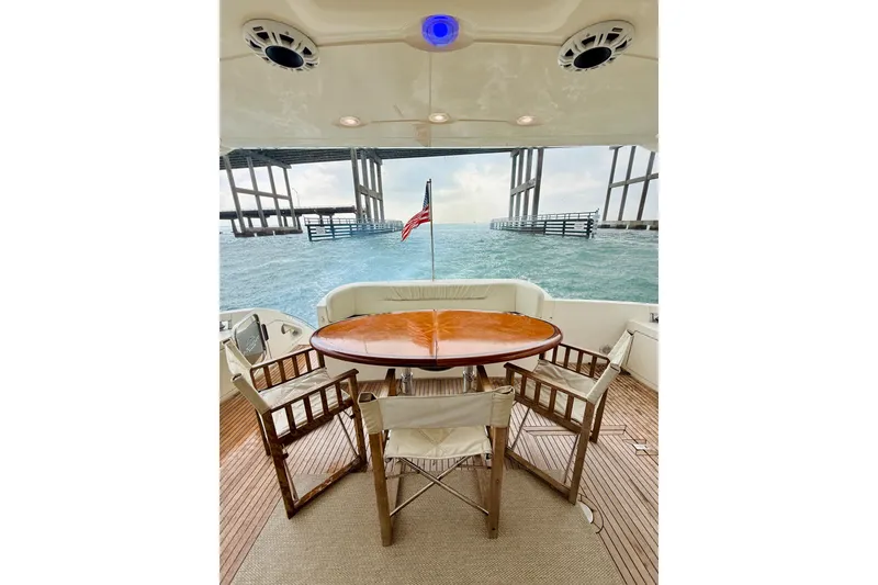 Slide: The Image of Luxury yacht Azimut 68E 2007, featuring elegant outdoor seating with ocean view. - 61