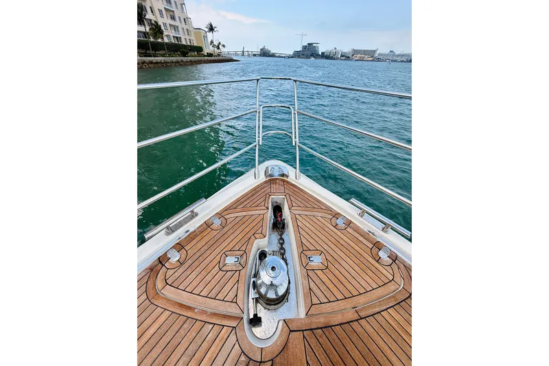 Slide: The Image of Bow view of 2007 Azimut 68E yacht with teak deck and ocean backdrop. - 69