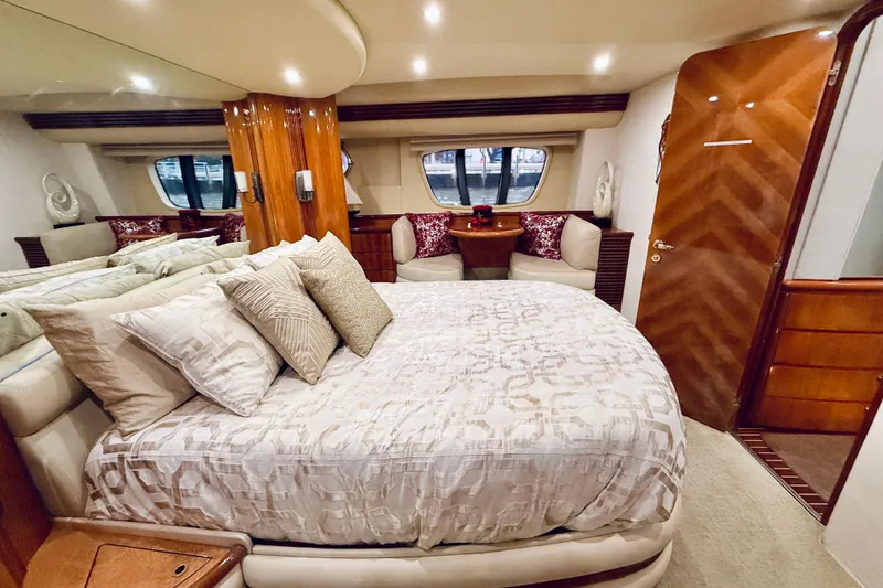 Slide: The Image of Luxurious bedroom interior of 2007 Azimut 68E yacht with elegant decor and plush bedding. - 50