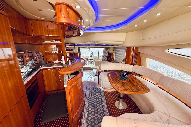 Slide: The Image of Luxurious interior of a 2007 Azimut 68E yacht with elegant wood finishes and modern design. - 24