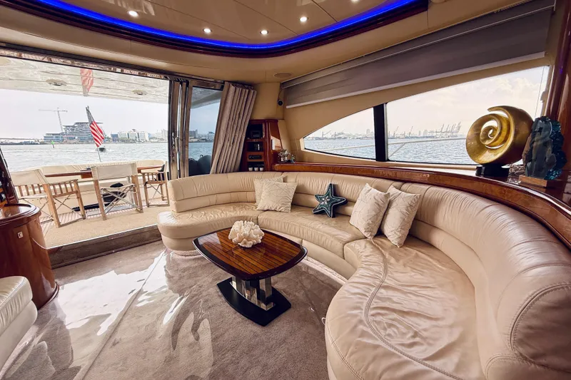Slide: The Image of Luxurious interior of 2007 Azimut 68E yacht with elegant seating and waterfront view. - 16