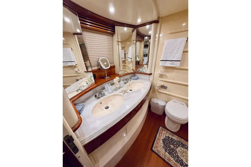 Slide: The Image of Luxurious bathroom in 2007 Azimut 68E yacht with dual sinks and elegant decor. - 55